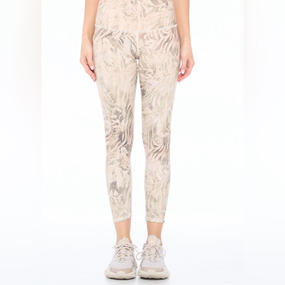 Evolution and Creation Cream Leggings with Elegant Print
